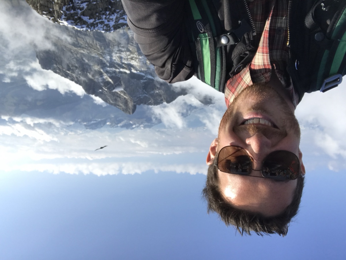 Above the clouds on a summit in the Alps